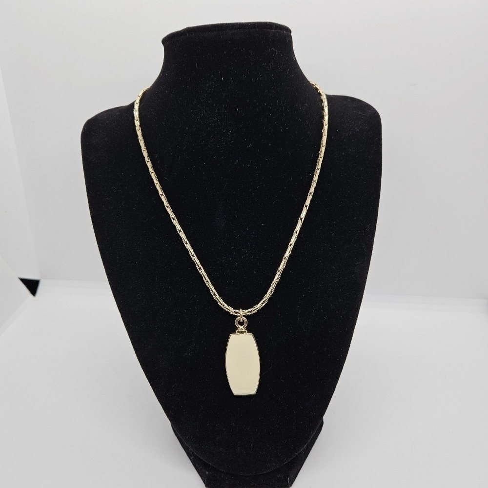 Liz Claiborne gold tone necklace with cream colored pendant